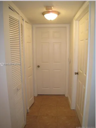a view of a room with a door