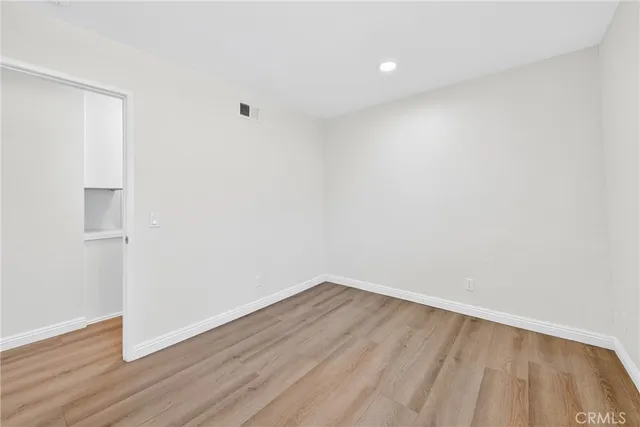 a view of room with wooden floor