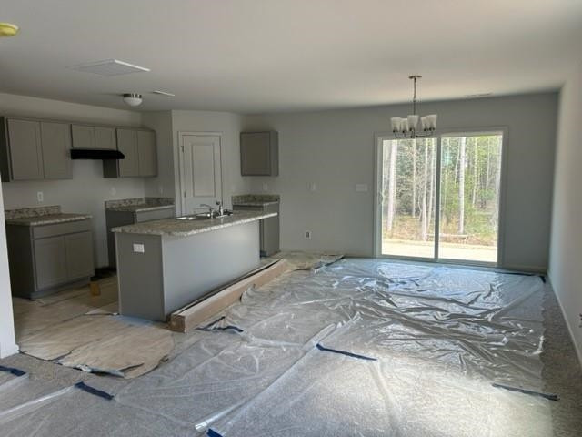 266 Riley Way Spring Hope, NC 27882 - Photo 5 of 18 a kitchen with stainless steel appliances granite countertop a stove sink and cabinets