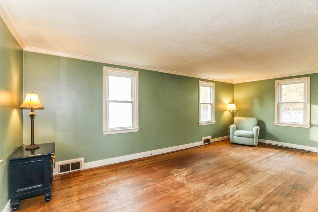 8 Maxwell Place Springfield, MA 01118 - Photo 8 of 36 a bedroom with a bed and wooden floor