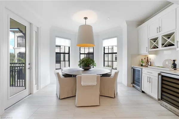 a kitchen with stainless steel appliances kitchen island granite countertop a stove and a sink