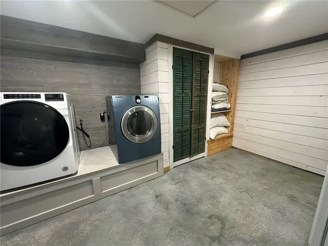 a utility room with dryer and washer