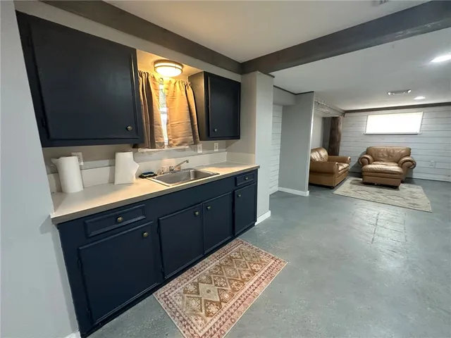 a view of a kitchen with furniture and a kitchen