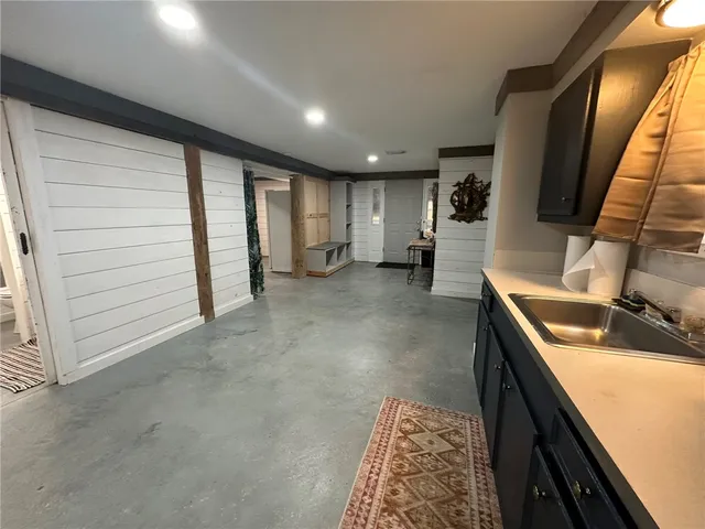 a living room with furniture and a rug