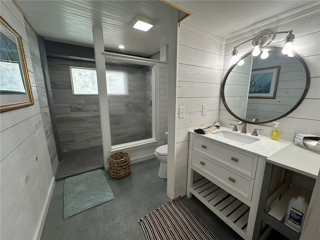 810 South Sandpiper Street Ingleside, TX 78362 - Photo 21 of 40 a bathroom with a sink a toilet and a mirror