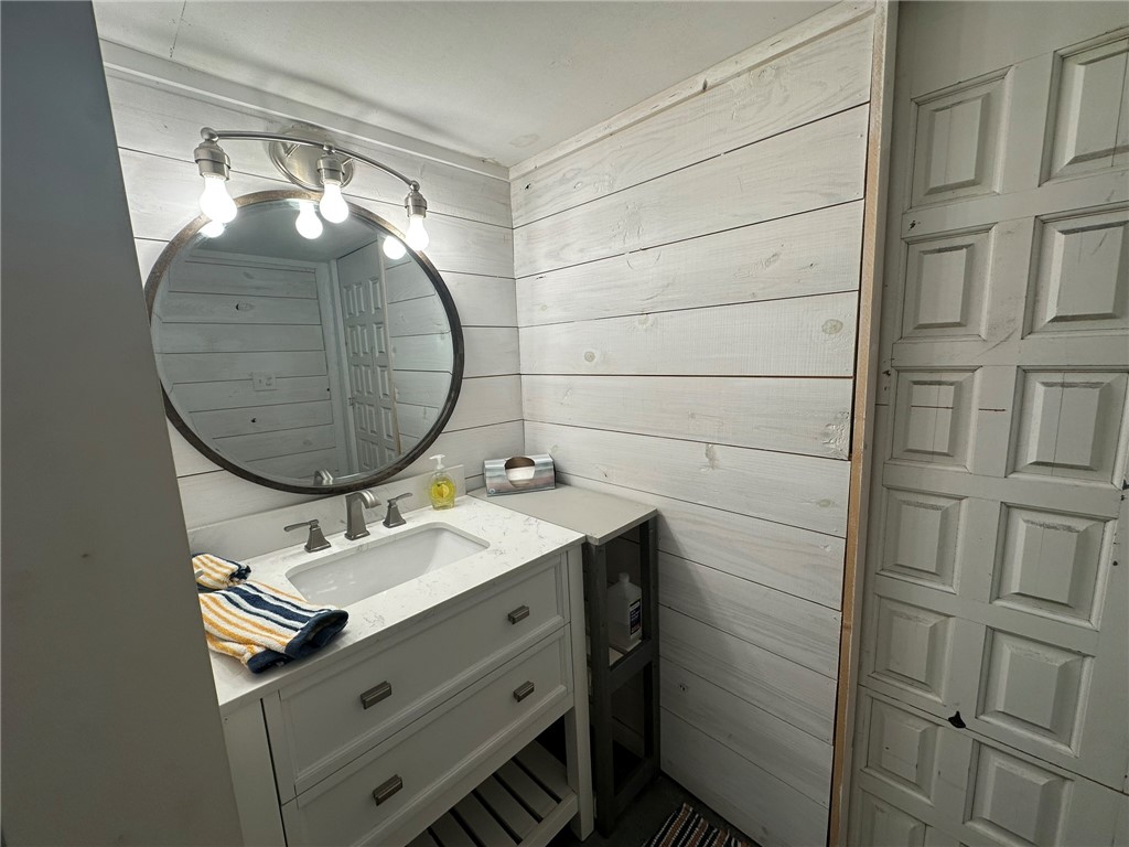 810 South Sandpiper Street Ingleside, TX 78362 - Photo 22 of 40 a bathroom with a sink a mirror and vanity