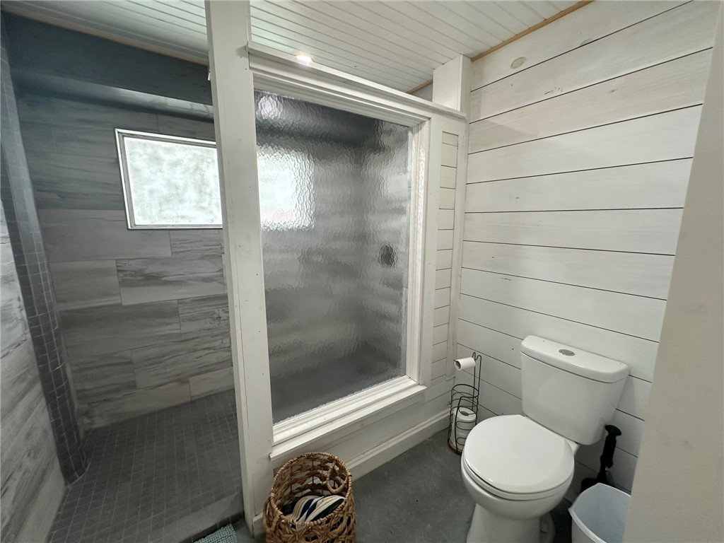 810 South Sandpiper Street Ingleside, TX 78362 - Photo 23 of 40 a bathroom with a toilet and a shower