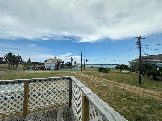 a view of a balcony with wooden floor