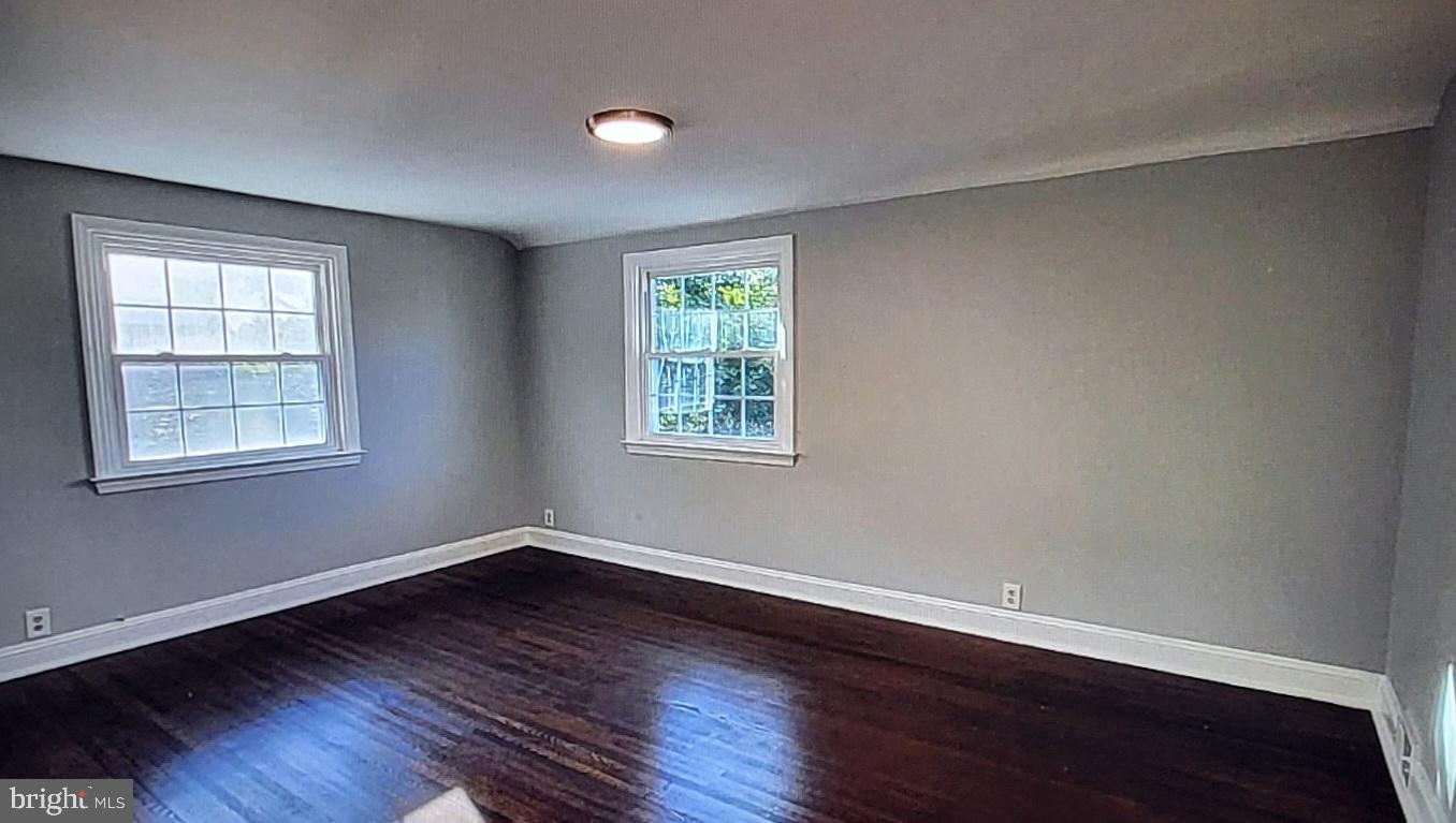 37 Schuyler Road Springfield, PA 19064 - Photo 13 of 29 a view of a room with wooden floor and windows in it