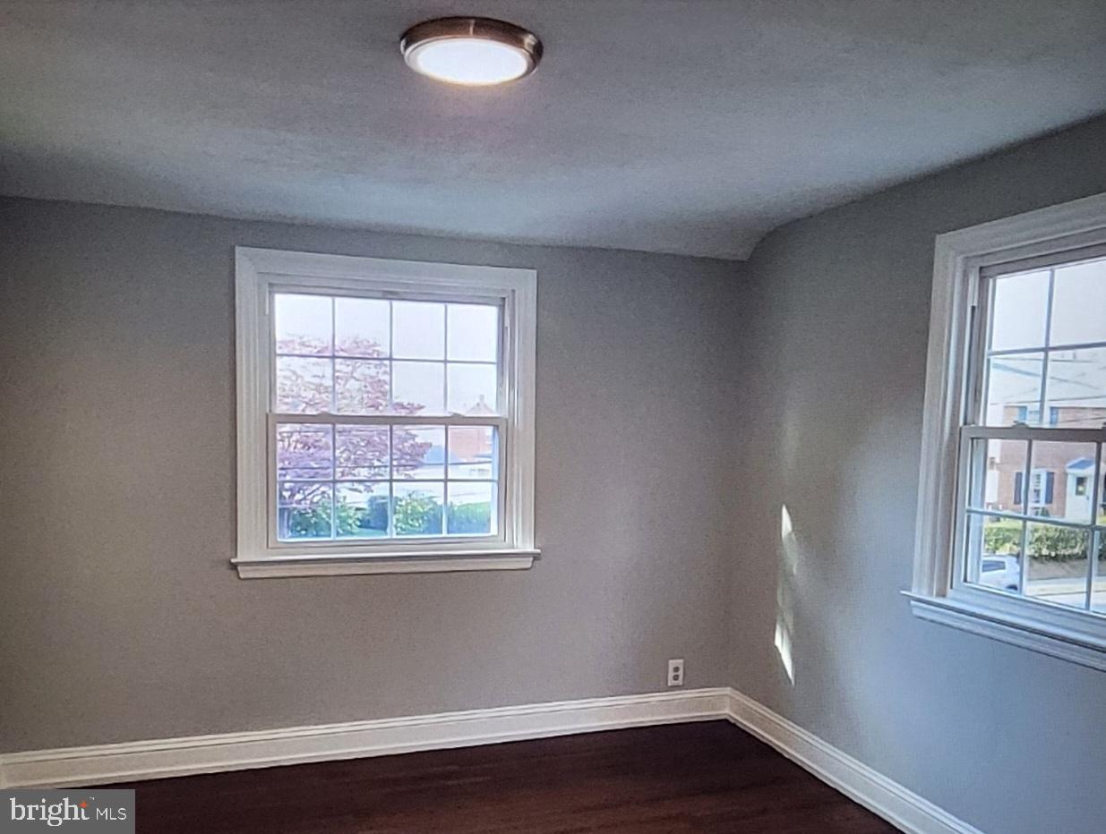 37 Schuyler Road Springfield, PA 19064 - Photo 15 of 29 an empty room with wooden floor and windows