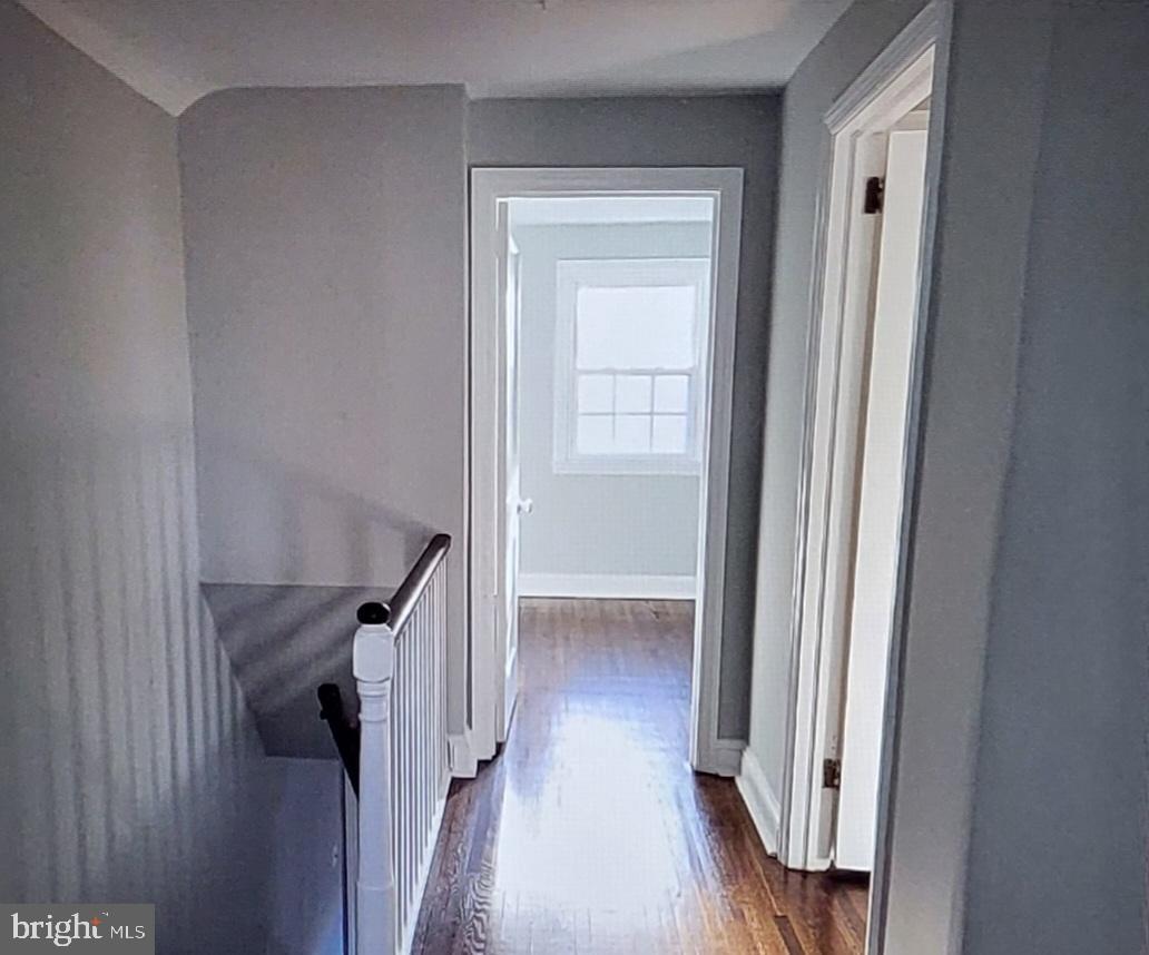 37 Schuyler Road Springfield, PA 19064 - Photo 18 of 29 a view of a hallway with wooden floor and staircase