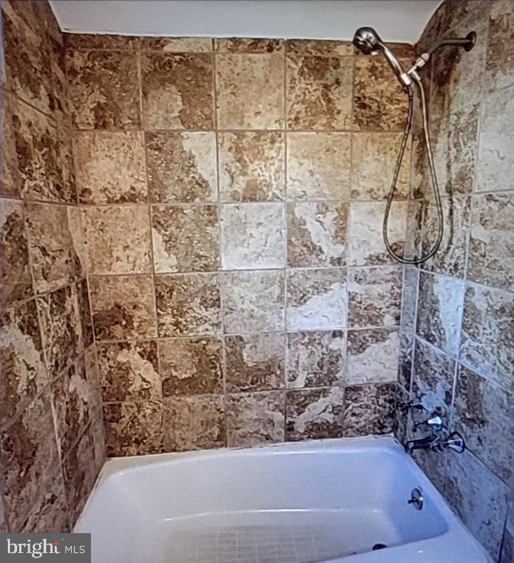 37 Schuyler Road Springfield, PA 19064 - Photo 21 of 29 a bathroom with a bathtub and shower