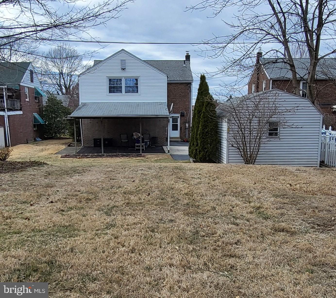 37 Schuyler Road Springfield, PA 19064 - Photo 28 of 29 a view of a house with a barbeque and large trees