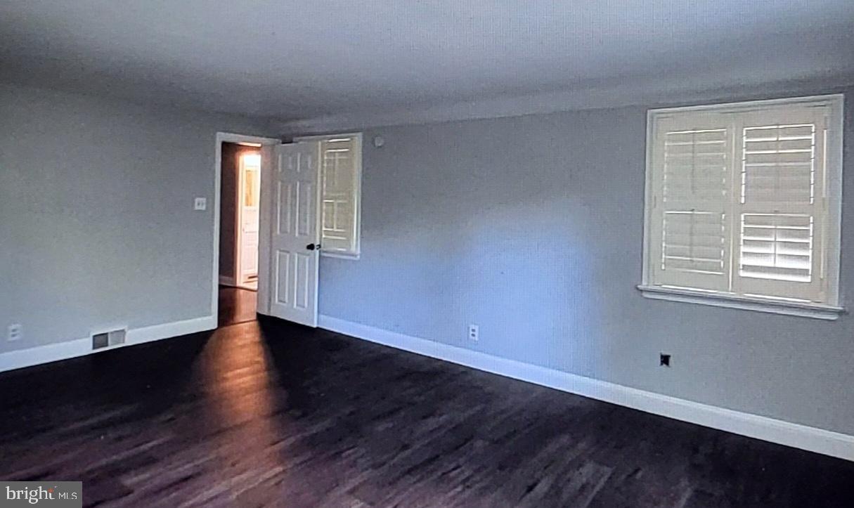 37 Schuyler Road Springfield, PA 19064 - Photo 9 of 29 a view of an empty room with wooden floor and a window