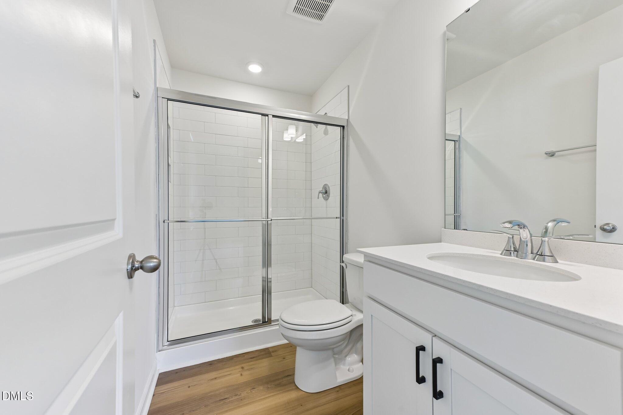 3019 Chrys Street Durham, NC 27704 - Photo 32 of 46 a bathroom with a sink a toilet and shower