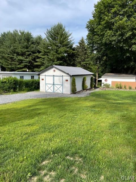 812 Bangor Road Nazareth, PA 18064 - Photo 6 of 28 a view of a house with a big yard and large trees
