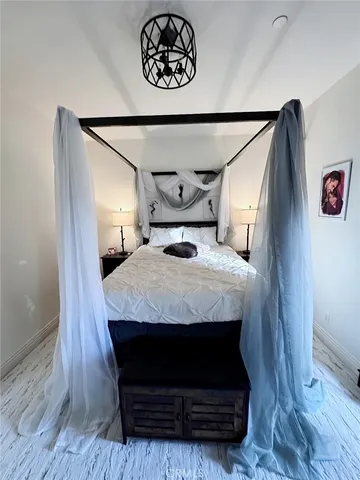 a bedroom with a bed and a table