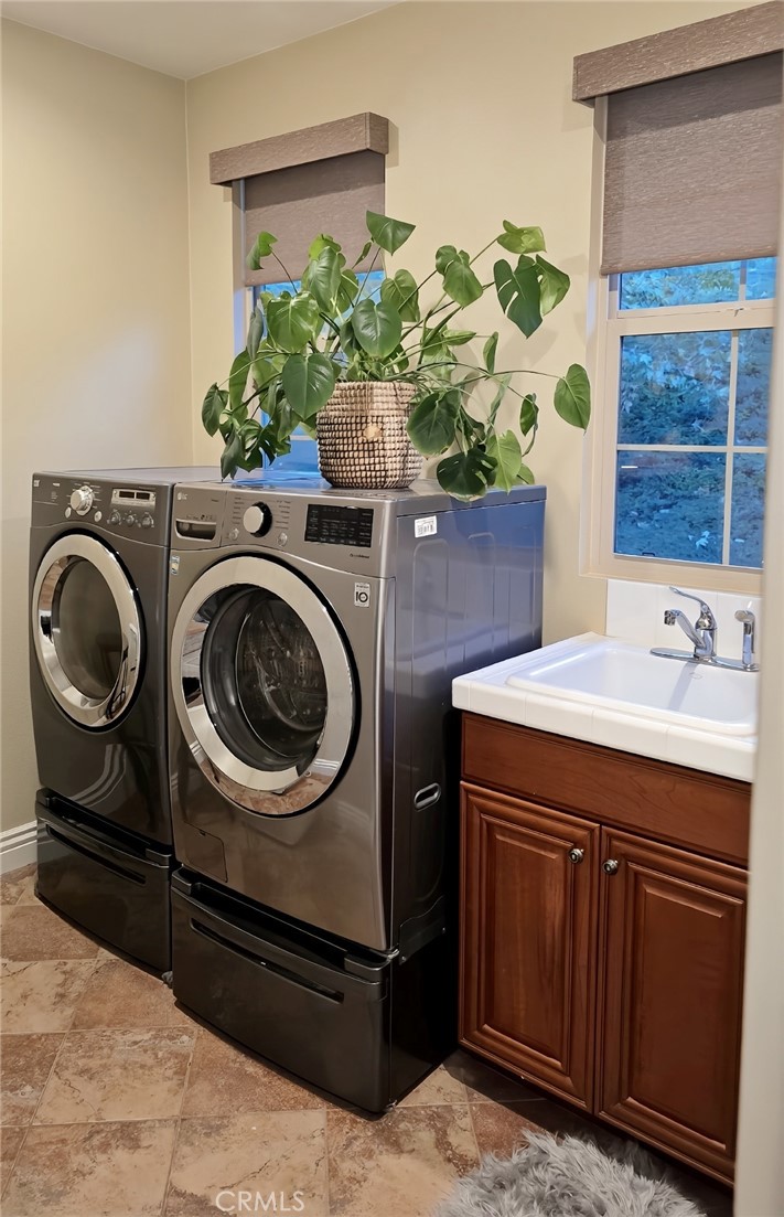 26661 Paseo Callado San Juan Capistrano, CA 92675 - Photo 17 of 25 a utility room with dryer and washer