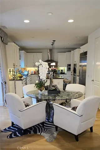 a living room with furniture and kitchen view