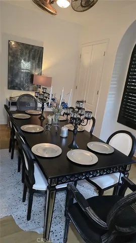 a dining room with furniture and wooden floor