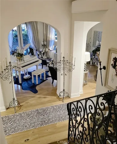 a view of living room with furniture and wooden floor