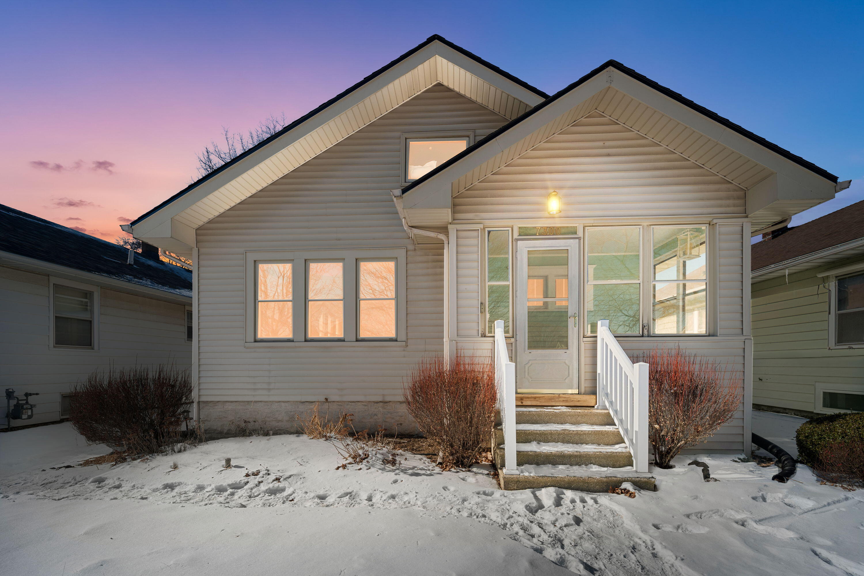7300 35th Avenue Kenosha, WI 53142 - Photo 1 of 16 Twilight view highlighting the home’s inviting presence and cozy neighborhood setting.