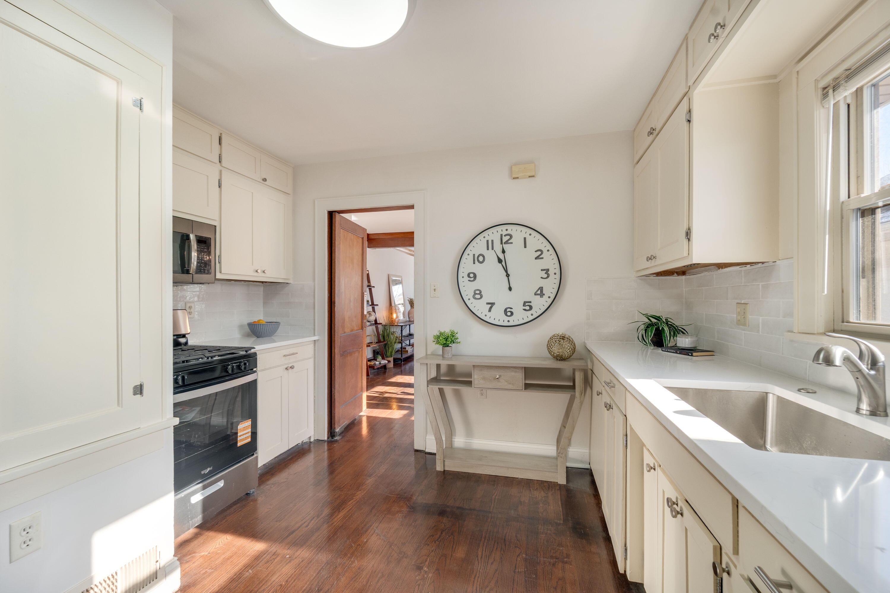 7300 35th Avenue Kenosha, WI 53142 - Photo 7 of 16 Another view of the kitchen highlighting excellent storage, updated finishes, and seamless flow to the main living areas.