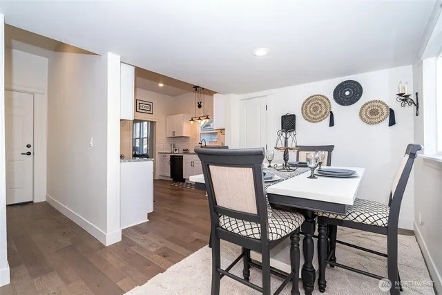 a view of a dining room with furniture and wooden floor