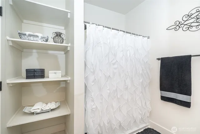 a bathroom with a bathtub and a shower