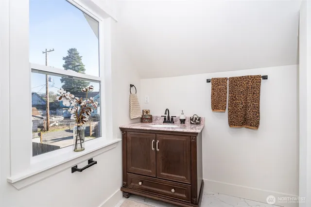 a bathroom with a shower and a bath tub