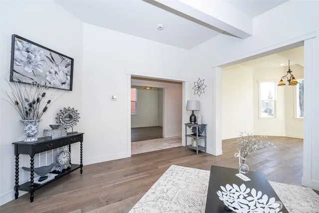 a bedroom with furniture and wooden floor