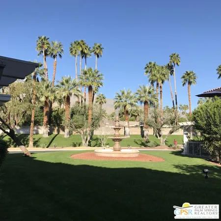 a view of a yard with a fountain