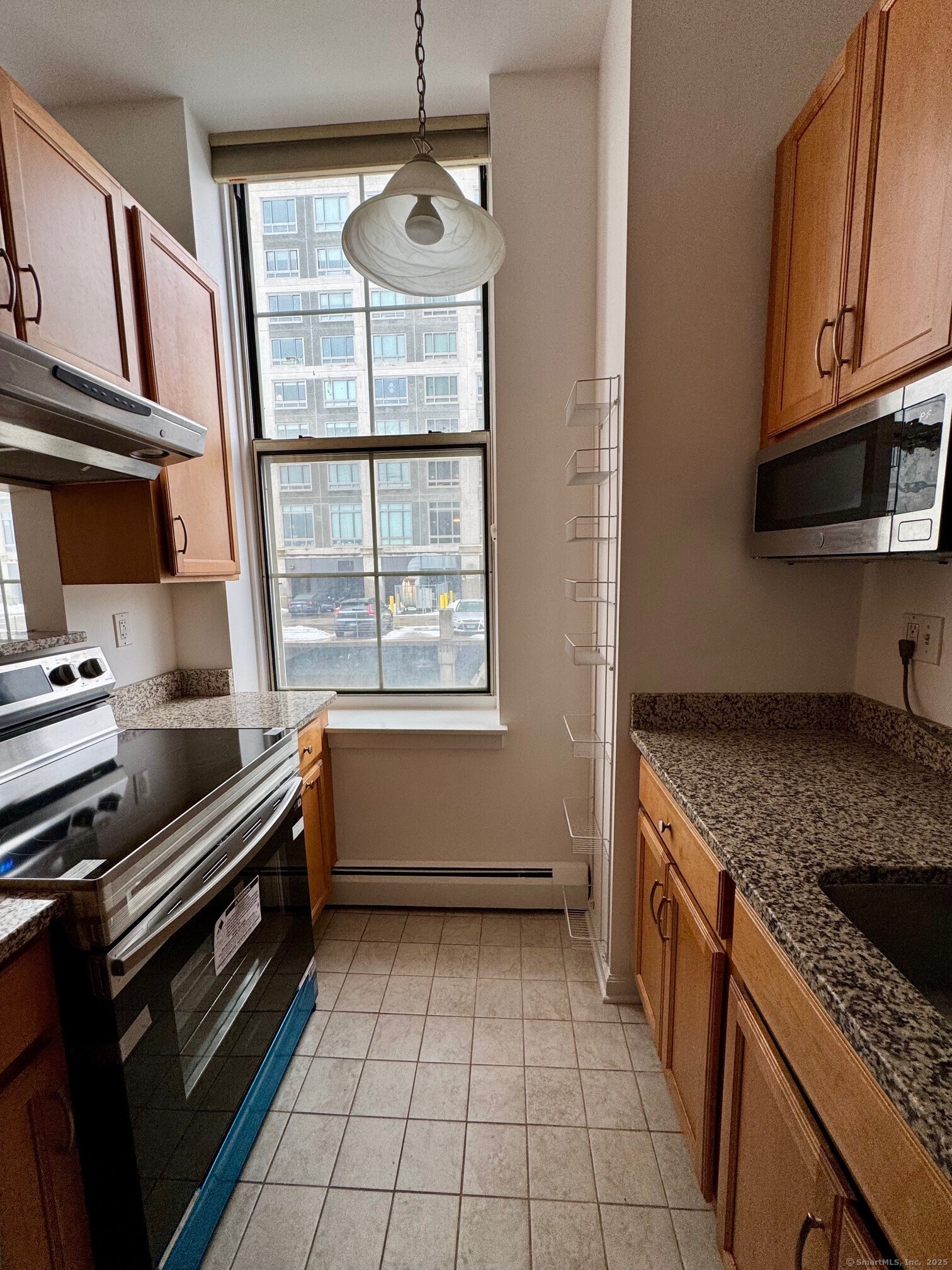 a kitchen with a sink a stove and cabinets