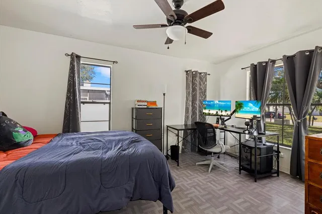 a living room with furniture and a clock