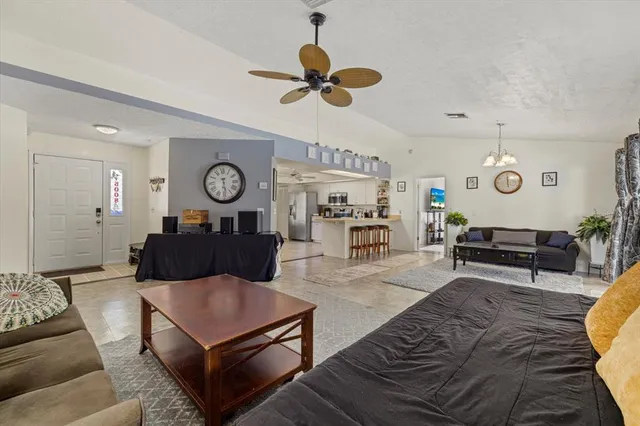 a kitchen with a refrigerator and a sink