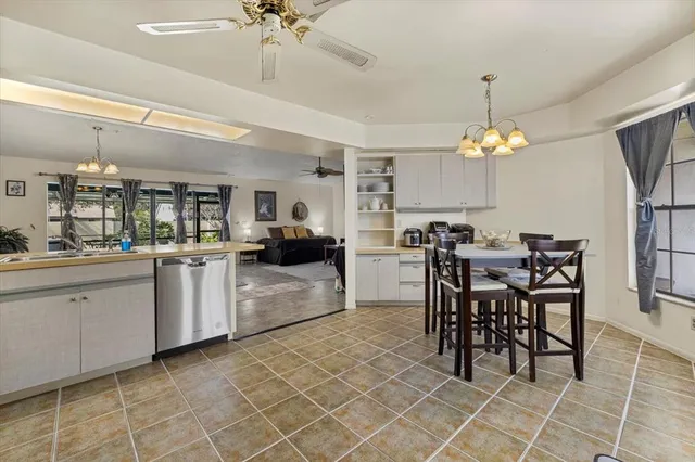 a view of a living room and floor to ceiling windows