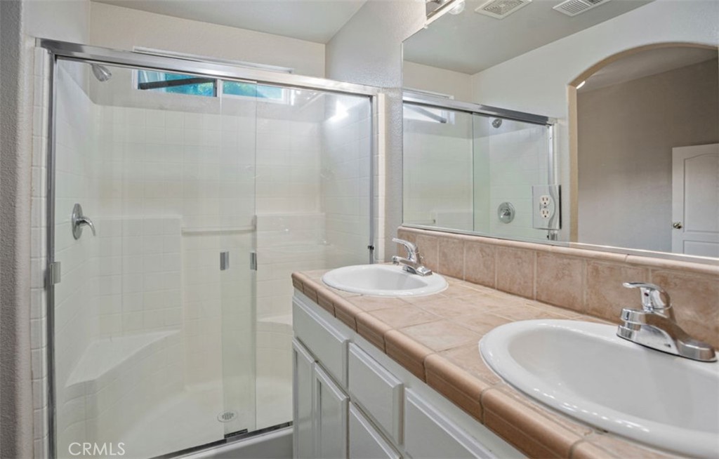 2139 Chesler Street Merced, CA 95348 - Photo 14 of 19 a bathroom with a sink and a mirror