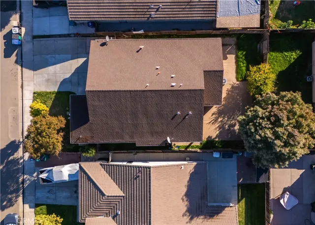 an aerial view of house with yard