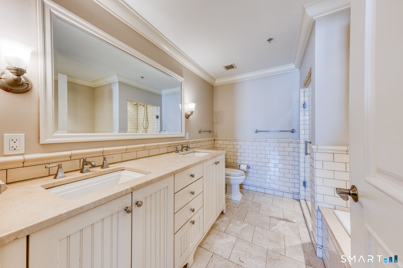 85 Memorial Road, Unit 411 West Hartford, CT 06107 - Photo 11 of 24 a spacious bathroom with a double vanity sink mirror and double