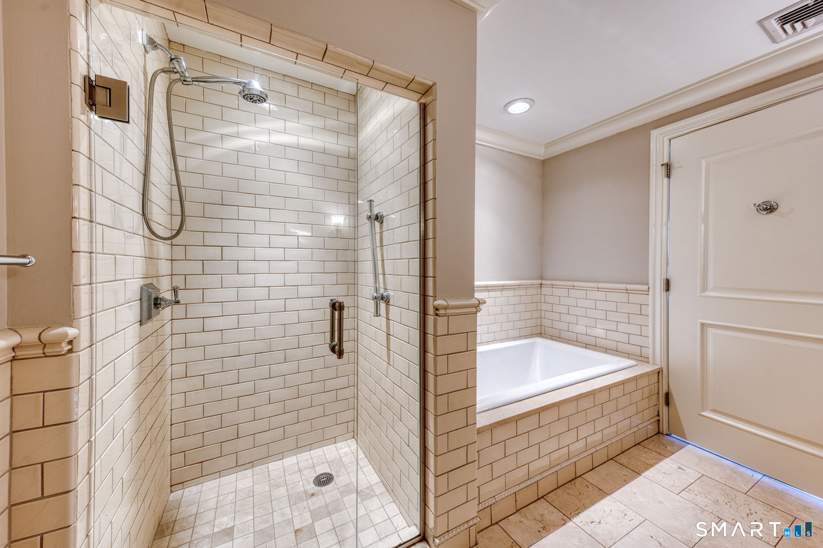 85 Memorial Road, Unit 411 West Hartford, CT 06107 - Photo 12 of 24 a bathroom with a bathtub and a shower