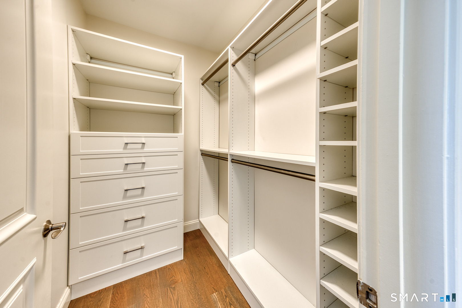 85 Memorial Road, Unit 411 West Hartford, CT 06107 - Photo 13 of 24 a view of walk in closet with empty racks