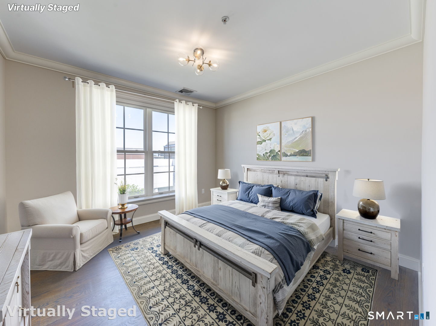 85 Memorial Road, Unit 411 West Hartford, CT 06107 - Photo 14 of 24 a bedroom with a bed and a couch