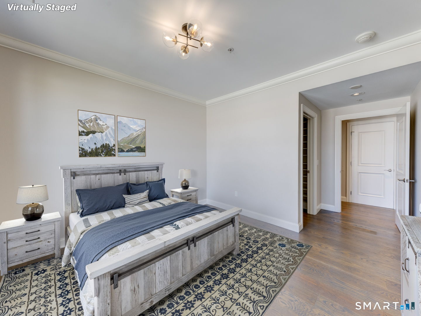 85 Memorial Road, Unit 411 West Hartford, CT 06107 - Photo 15 of 24 a bedroom with furniture and wooden floor