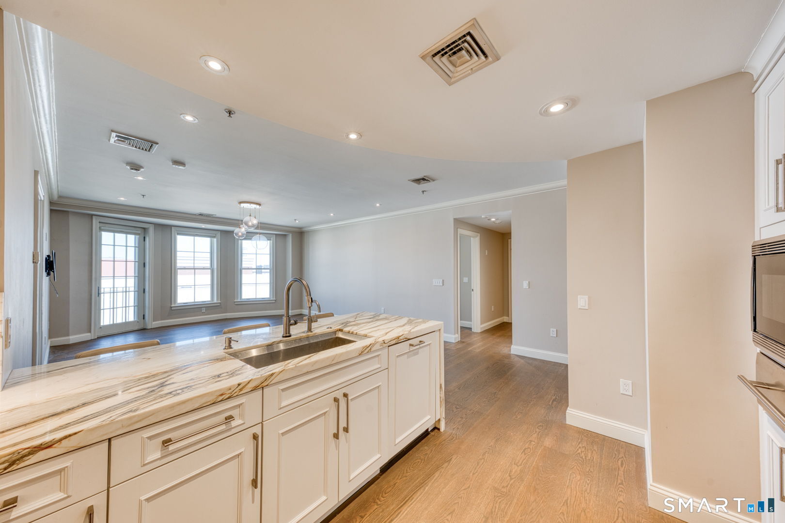 85 Memorial Road, Unit 411 West Hartford, CT 06107 - Photo 8 of 24 a spacious bathroom with a sink and a large mirror