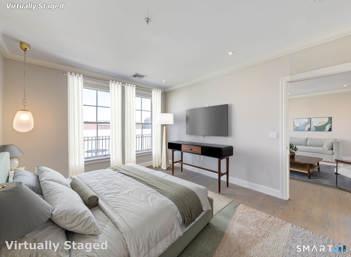 85 Memorial Road, Unit 411 West Hartford, CT 06107 - Photo 9 of 24 a bedroom with a bed and a flat screen tv