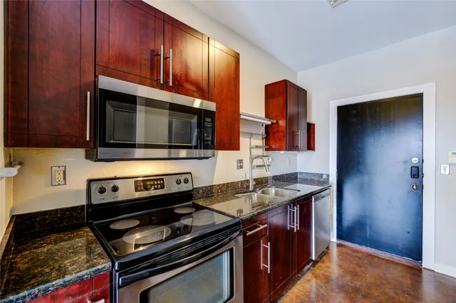 a kitchen with a stove and a microwave