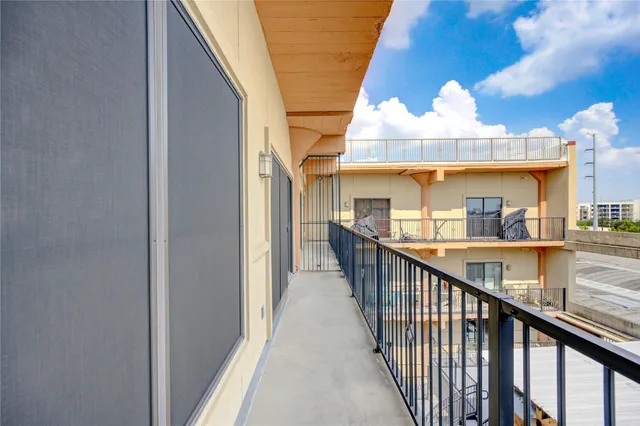 a building outdoor space with patio furniture and window