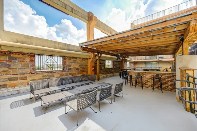 a outdoor space with patio furniture and garden view
