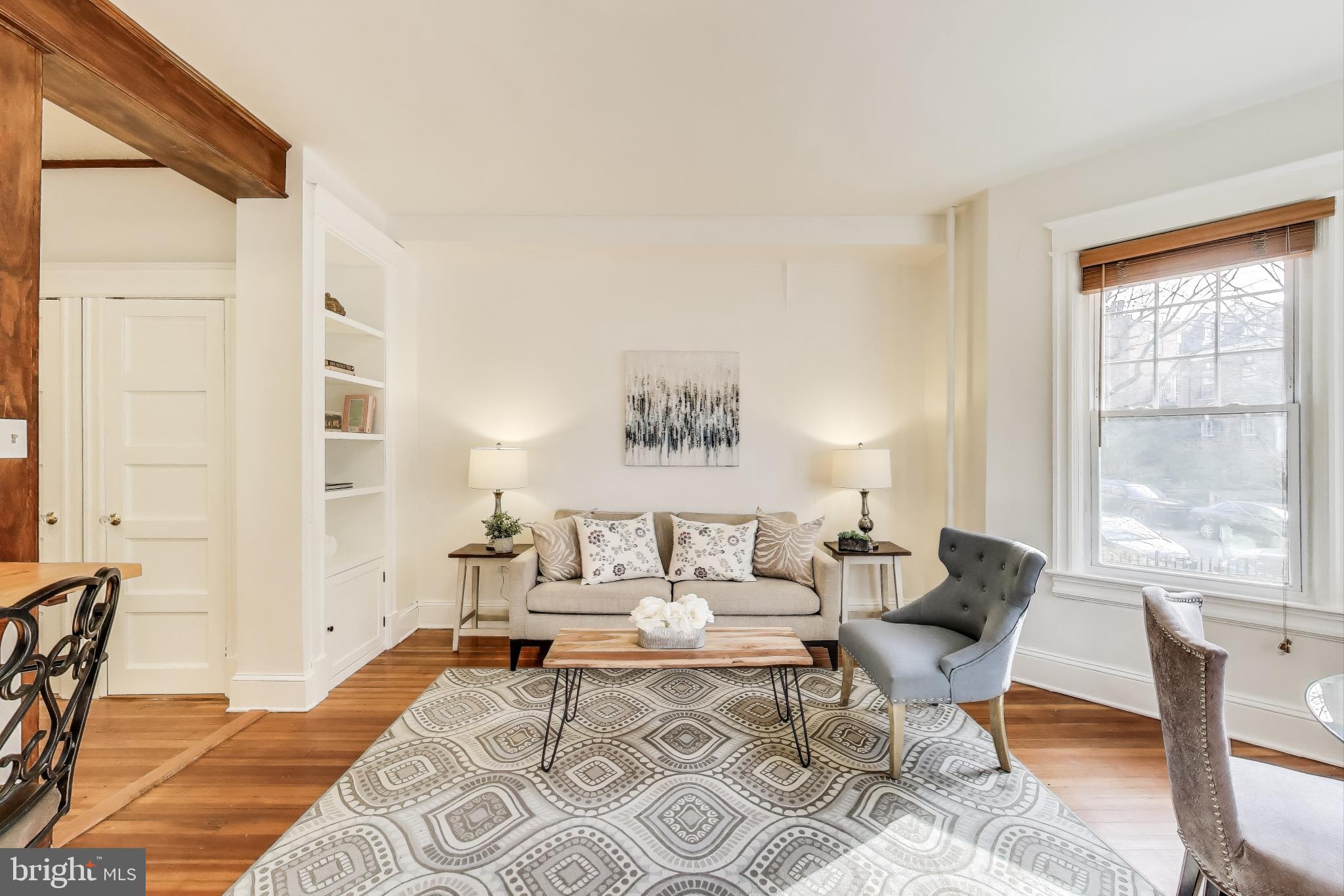 1791 Lanier Place Northwest, Unit 2 Washington, DC 20009 - Photo 16 of 30 a living room with furniture and a large window