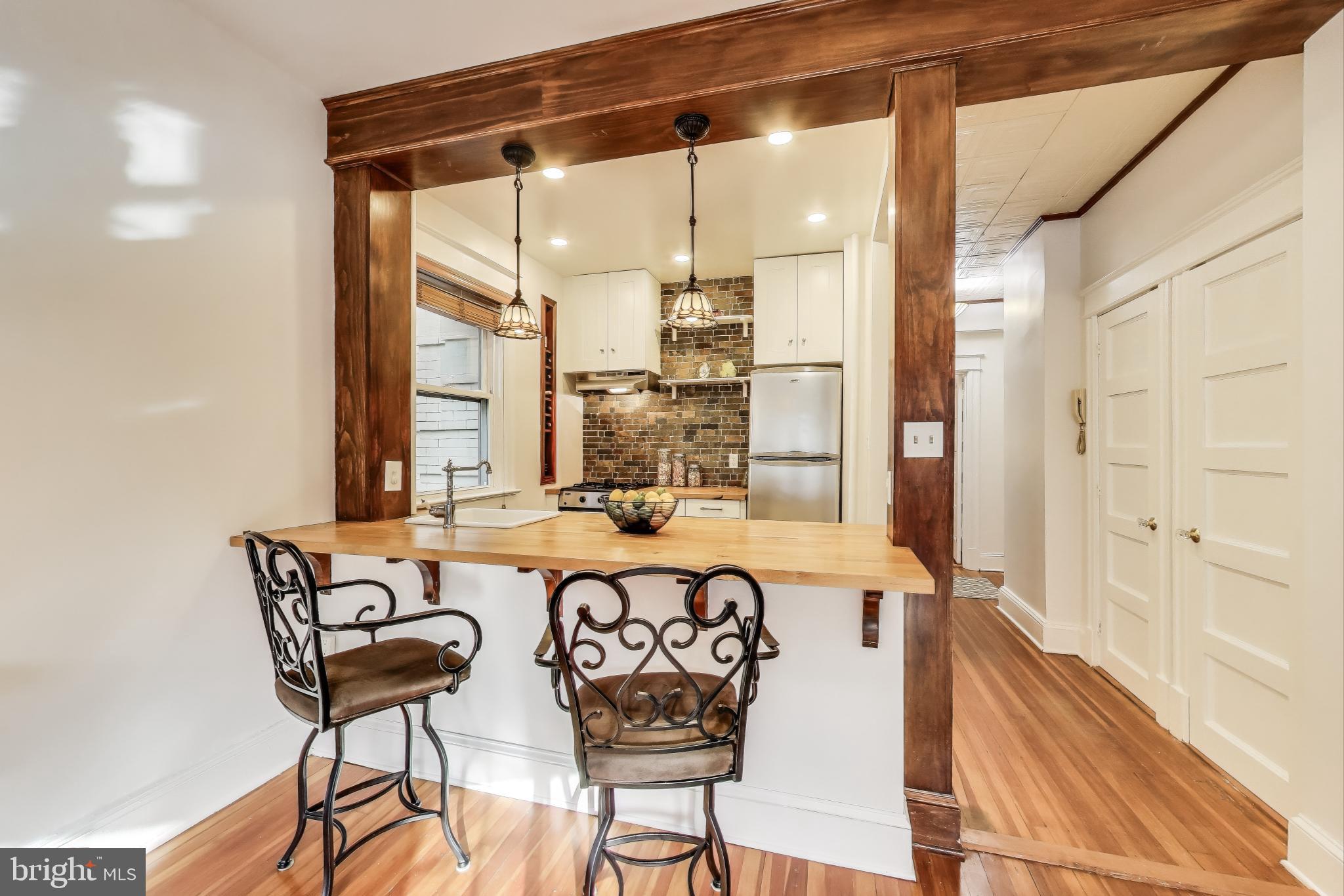 1791 Lanier Place Northwest, Unit 2 Washington, DC 20009 - Photo 18 of 30 a view of a dining room with furniture window and outside view